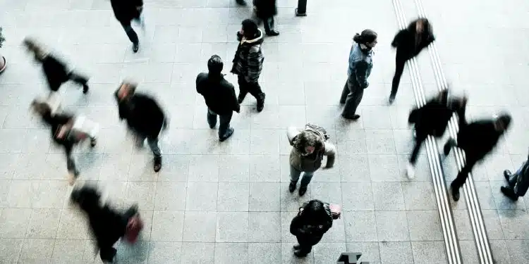 people walking on grey concrete floor during daytime