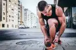 man tying his shoes