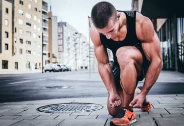 man tying his shoes