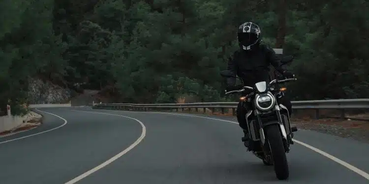 man riding motorcycle on concrete street